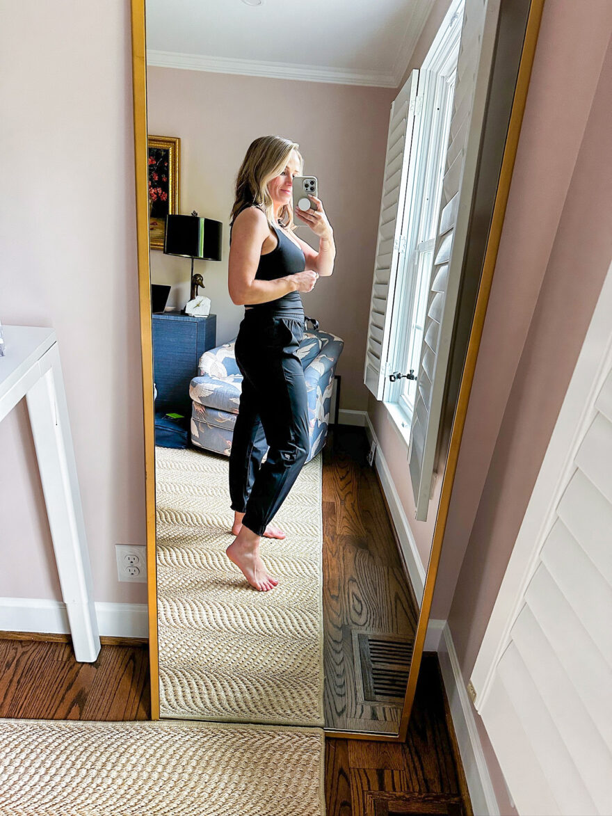 Terilyn Adams wearing the lightweight Fabletics One Joggers with the soft Oasis Rib Twist Built-in Bra Tank