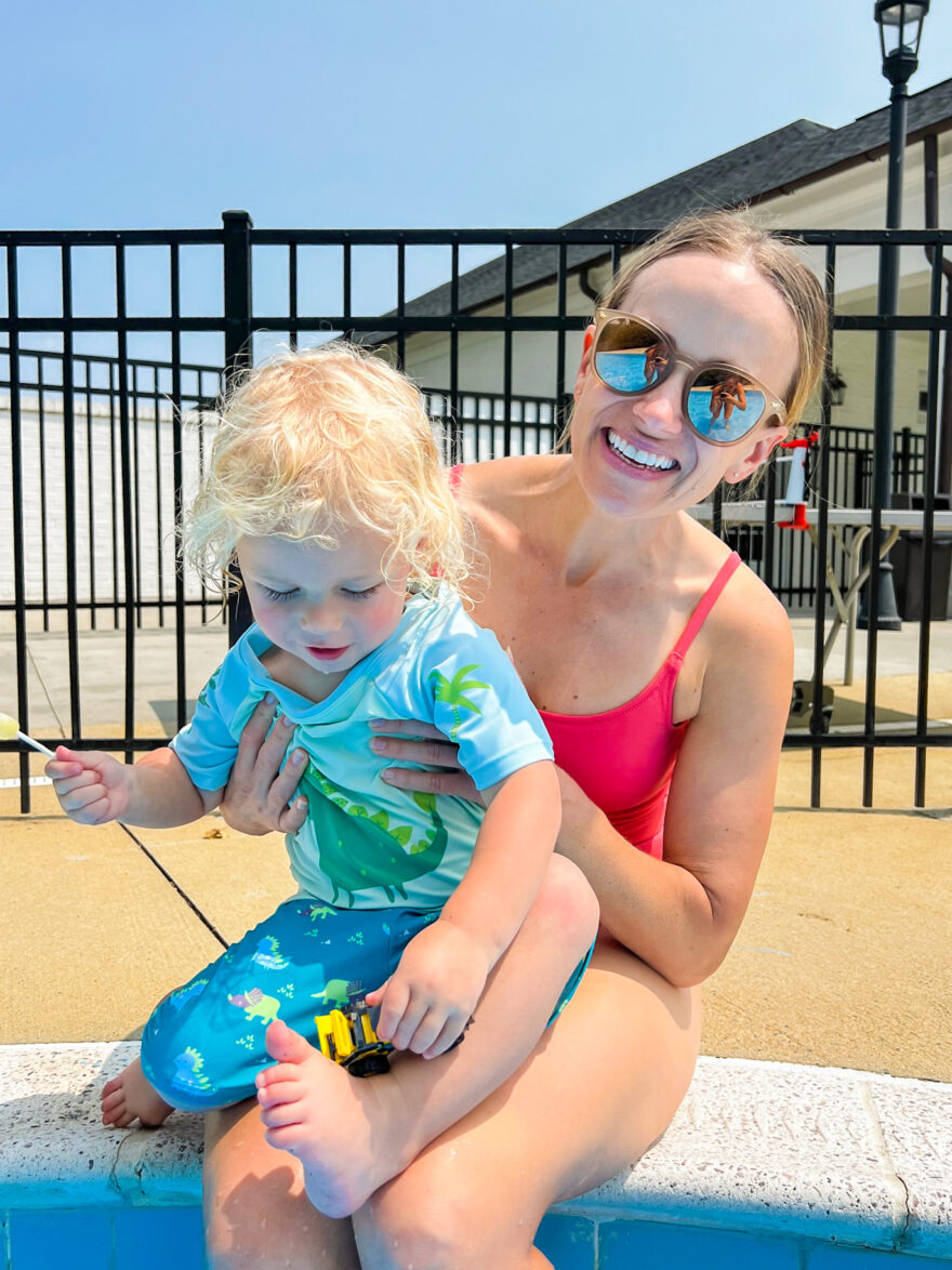 TeriLyn Adams wearing sunglassess and pink one piece swimwear as one of her styling tips for hot weather